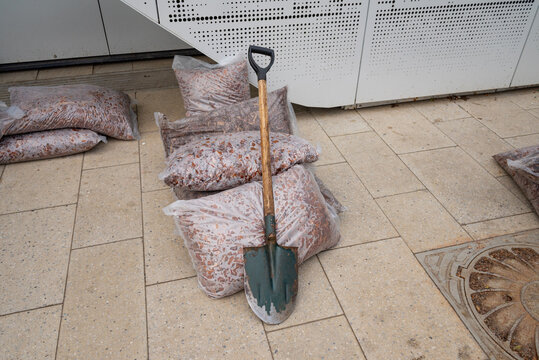 Shovel on plastic bags with fertilizer
