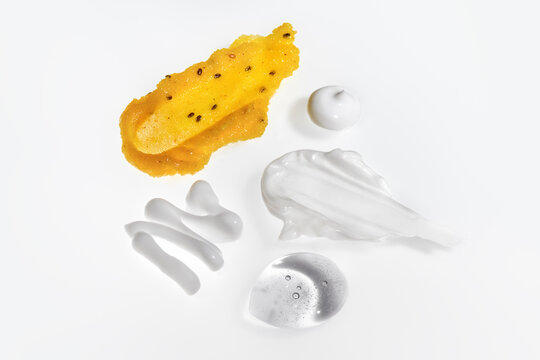Different Textures and Forms of Creams and Gels on White Background