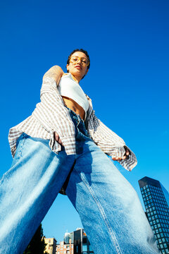 Low angle portrait of a stylish young woman