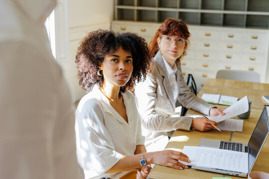 Professionals collaborating in a modern office environment
