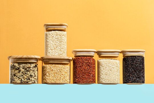 Different types of rice in glass storage containers