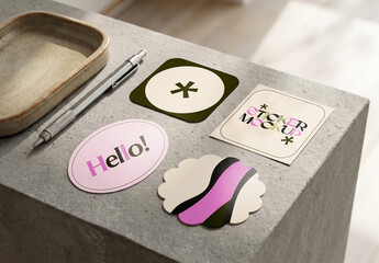 Assorted Sticker Shape Set Mockup on Concrete Surface