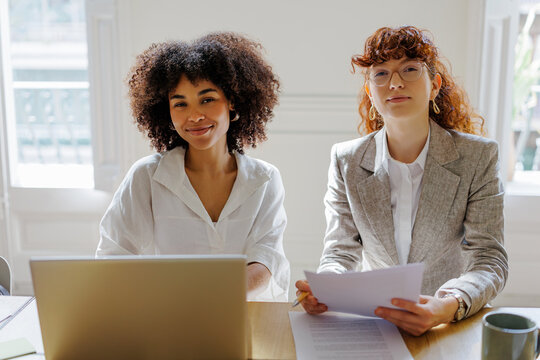 Female professionals collaborating in a modern office environment