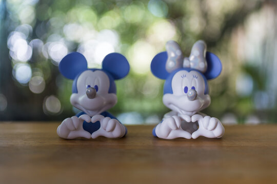 Bangkok, Thailand - July 2, 2026 : Character Disney 100 Mickey Mouse and Minnie Mouse. Love Hand Mini Bust