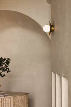 Modern wall sconce lighting on microcement interior