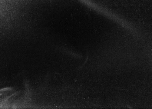 Dusty scratched and scanned old film texture, light leaks overlay effect. Retro analog cinematic flare. 