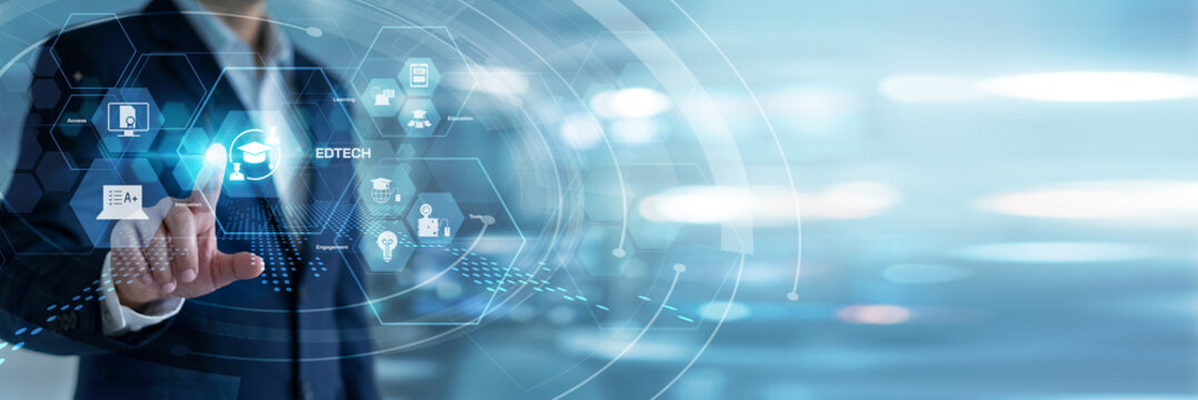 Education technologist programming and touching EdTech software applications on a futuristic virtual screen. Smart classroom integration, personalized learning paths, and student progress.