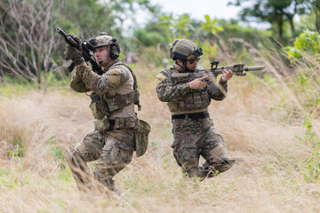 Fototapeta premium Military participate in a patrol in a rocky terrain