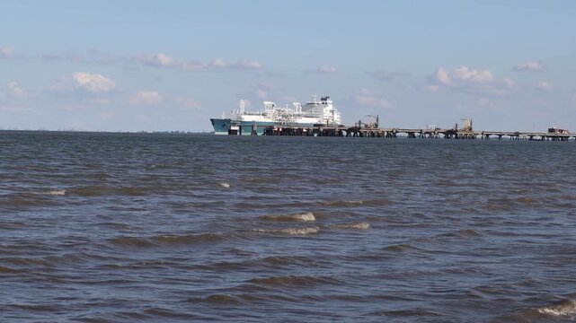 Liquefied natural gas tanker moored at a marine terminal