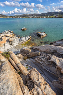 Unique rock formations by the Aegean sea at the Kolymbithres Beach on Paros island in Greece on a sunny day.