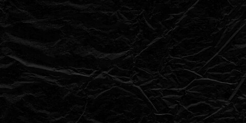 Naklejka premium Crumpled black paper texture background. Wrinkled paper surface abstract background. crumpled torn and old black paper
