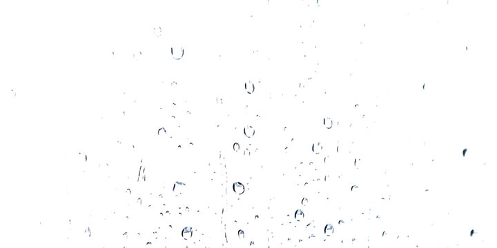 Clear water droplets on a glass window surface during a rainy day