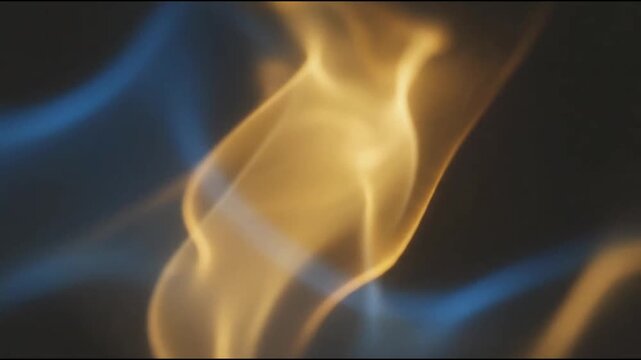 Abstract flowing golden and blue waves on dark background.
