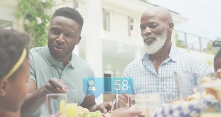 Family trio serving table while blue social notification overlaying, counting up tracking growth © vectorfusionart