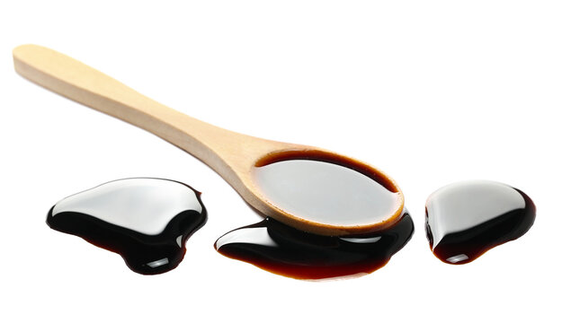 Wine vinegar in wooden spoon isolated on white background, side view