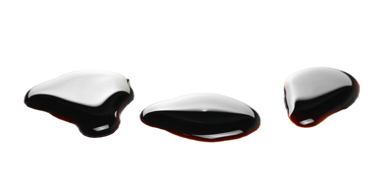Wine vinegar spilled, puddle isolated on white background, side view