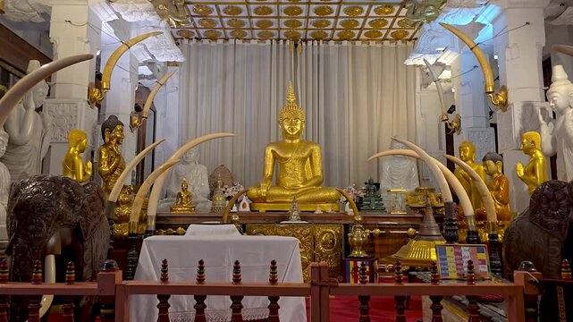 The New Shrine Room at Sri Dalada Maligawa in Kandy, Sri Lanka, featuring the replica Tooth Relic chamber, Buddha statues, and historic Buddhist murals. 4K
