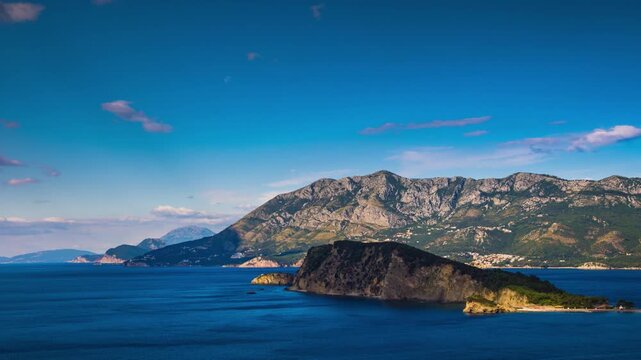 Island of St. Nicholas in the Adriatic Sea near the shores of the town of Budva in the rays of the sun