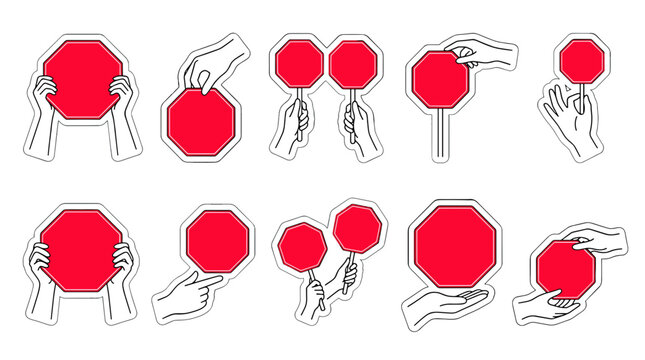 Collection of hand gestures holding various red stop signs in different positions and angles