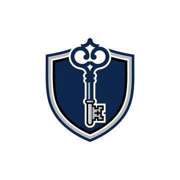 Antique skeleton key on blue shield crest emblem.
