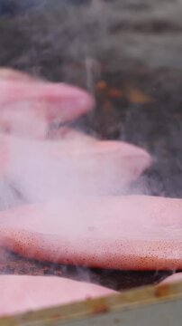 Ikayaki, Grilled roasted Squid with sauce - popular Japanese Street Food, variety of different traditional food snack selection in Tokyo, Japan, street market with local vendor stalls cooking