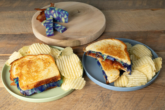 Ube gouda cheese and bacon grilled cheese and chips.