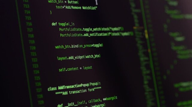 Green source code displayed on monitor during vibe coding supported by ai assistant. Programming scene highlights artificial intelligence integration and structured software architecture workflow.