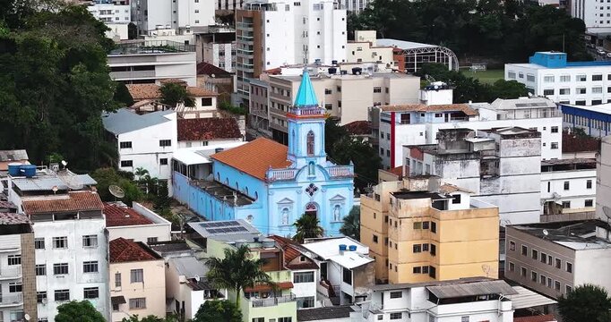 4K drone aerial view of Saint Sebastian Church surrounded by downtown Juiz de Fora, Minas Gerais, Brazil, featuring historic architecture.