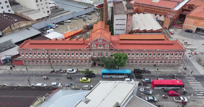 4K drone aerial view of Juiz de Fora Municipal Market in downtown Minas Gerais, Brazil, highlighting historic architecture and urban life.