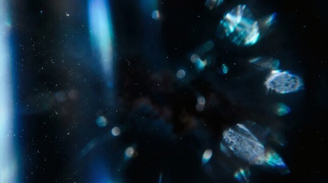 Cold blue light leak and icy sci-fi lens flare overlay with texture on dark void background