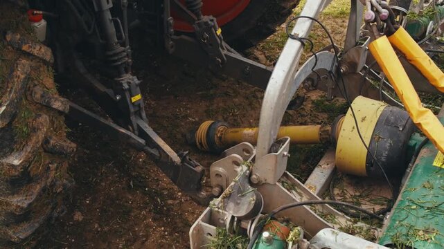 using operation of specialized machines tractors harvesters at workplace, cleaning starting connecting disconnecting mower plow. final stage of work. end of harvest, working day. uncoupling trailer