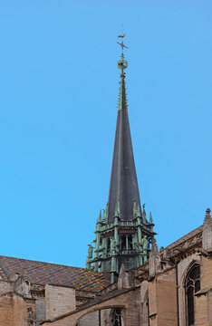 Tower and Burgundian colourful patterned roof of Saint Benigne with blue sky in the centre of the archdiocese Dijon, France