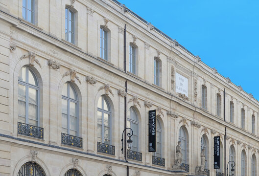 DIJON, FRANCE &ndash; APRIL 29, 2026:  Front gable of the museum of fine arts (mus&eacute;e des beaux arts), one of the biggest musea in France and the former palace of the dukes, with blue sky