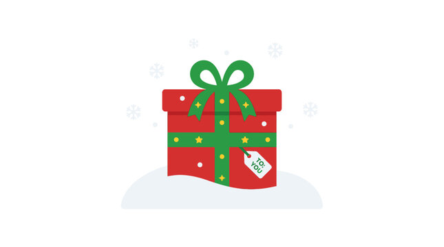 Red Christmas gift box with green ribbon and tag.