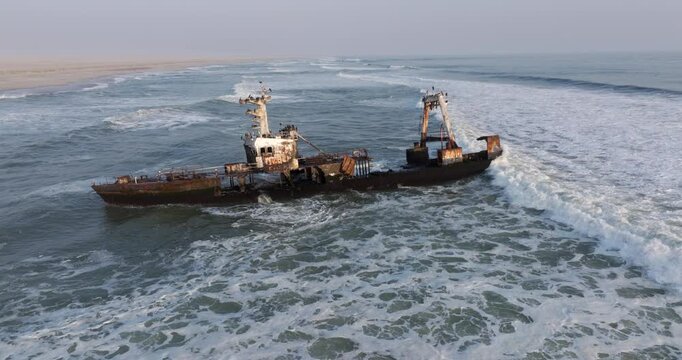Aerial orbiting shot of the Zeila shipwreck on the Skeleton Coast in Namibia, southwest Africa.