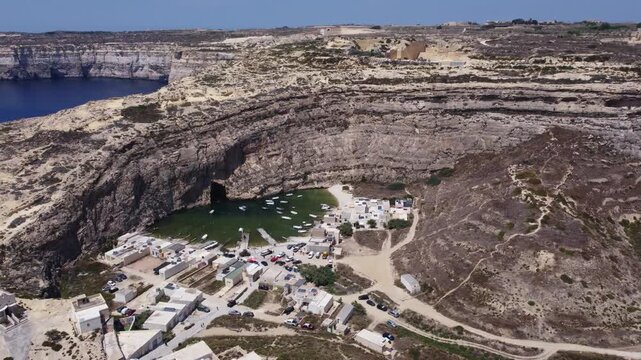 Dwejra Inland sea and cliffs on a sunny summer day. Aerial view Gozo island, Malta. High quality 4k footage