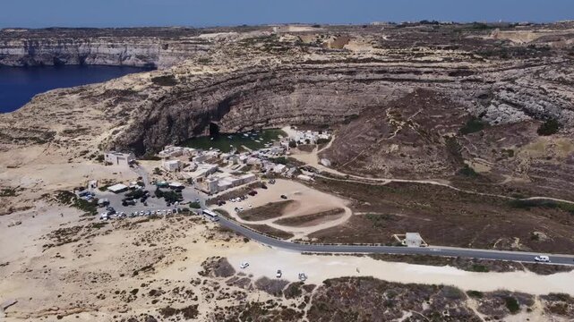 Dwejra Inland sea and cliffs on a sunny summer day. Aerial view Gozo island, Malta. High quality 4k footage