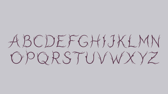 Thin script handwriting alphabet on gray background