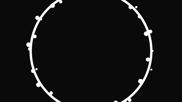 Abstract orange circular shape expanding and disintegrating into white particles on a black background.