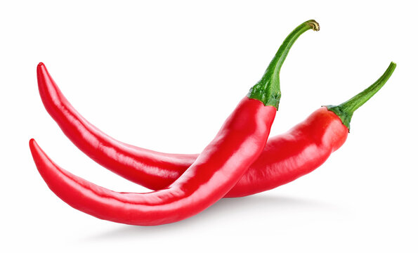 Two fresh red hot chili peppers on white background