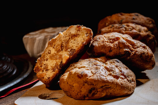 Homemade Oatmeal Cookies with Raisins and Candied Fruit on Rustic Wooden Background