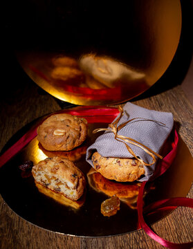 Homemade Oatmeal Cookies with Raisins and Candied Fruit on Rustic Wooden Background