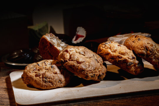 Homemade Oatmeal Cookies with Raisins and Candied Fruit on Rustic Wooden Background