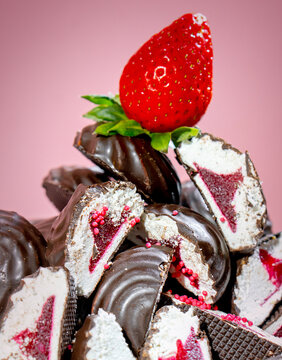 Chocolate Covered Marshmallows with Strawberry Filling and Fresh Strawberries on Pink Background