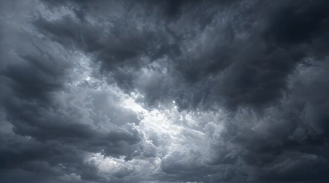 Powerful storm clouds in a dark sky, threatening weather atmosphere, heavy rain clouds, moody natural background, climate change visual, dramatic cloud formations