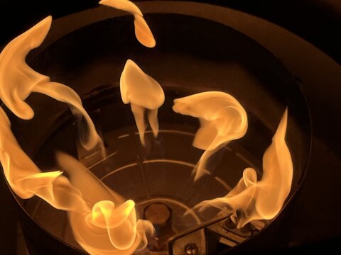 Close-up of a gas burner on a heater in operation - Gros plan sur un bruleur &agrave; gaz d'un chauffage en fonctionnement