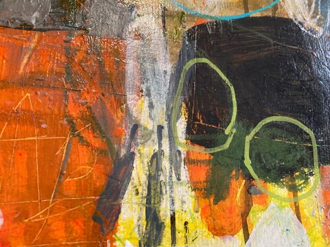 Abstract painting with dark circular shapes and orange field
