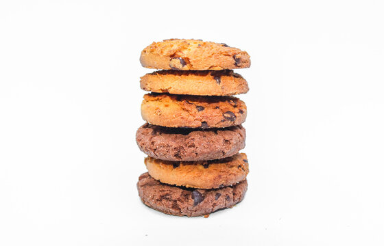 A stack of chocolate chip cookies isolated on a white background. Cookies with chocolate chips stack high.