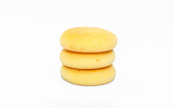 Delicious pineapple jam filled cookies isolated on white background. Golden round biscuit with sweet pineapple filling. Stack of cookies