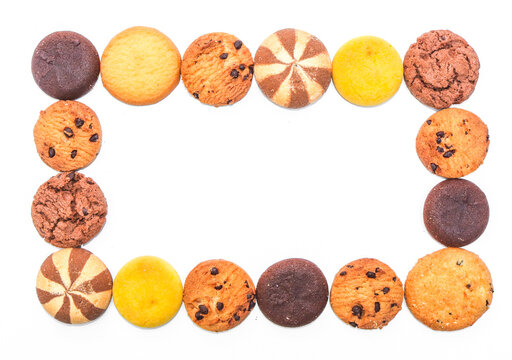Assorted cookies and biscuits arranged in a square shape copyspace isolated on white background. Collection of sweet baked snacks including chocolate cookies, butter biscuits, crackers 